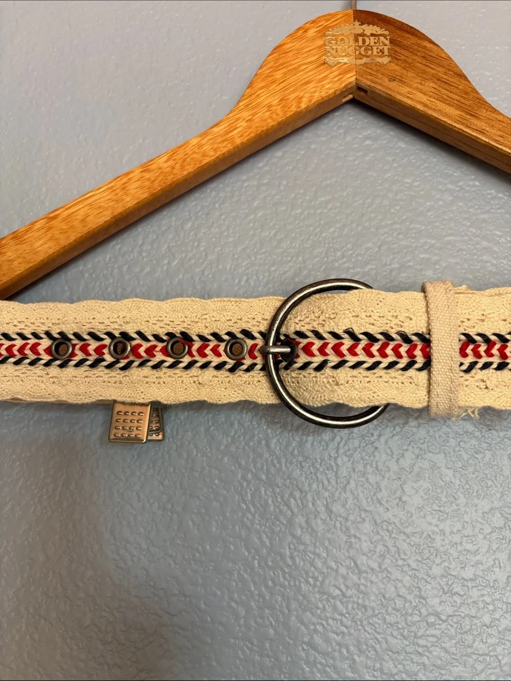Canvas cream color crochet belt with red and blue embroidered accents. Size 7